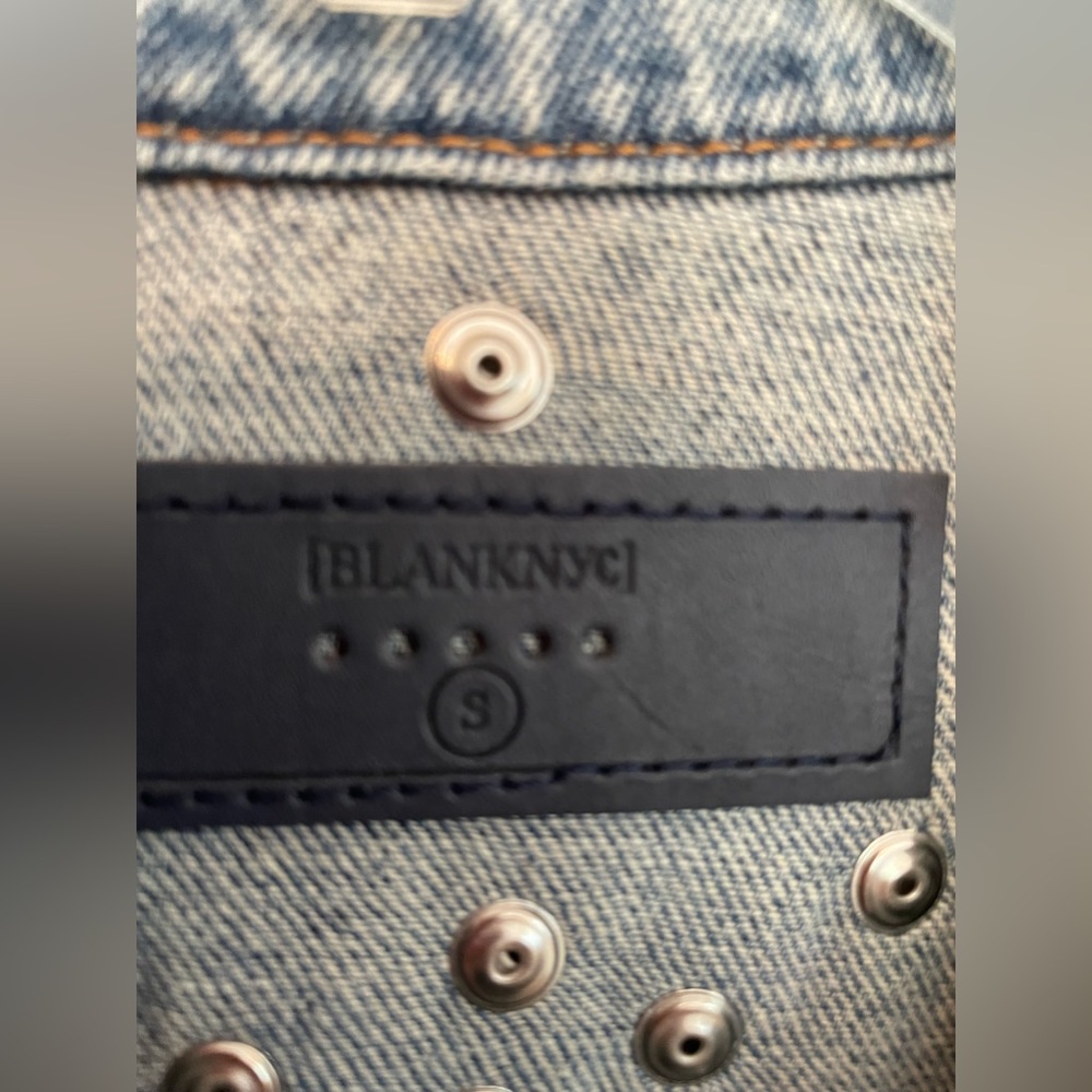 Denim jacket with fun “bling”. Size small but fits like a medium or a large